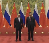 Ушаков: первый визит на новом президентском сроке Путин нанесет в Китай