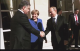 Мир увидел рукопожатие Путина и Порошенко