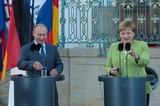 Путин и Меркель «сверили часы»