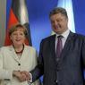 Ушаков: Меркель намерена провести переговоры с Порошенко после поездки в Сочи