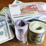 Официальный курс рубля укрепился к доллару и евро